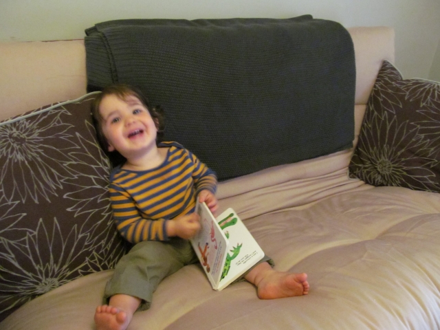 Colin, one year and seven months, loves to laugh...and read (sort of). From Chas Lyons